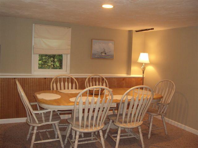 502 Skunknet Road Centerville, MA 02632 - Photo 9 of 24 a view of a dining room and chairs and table in a room