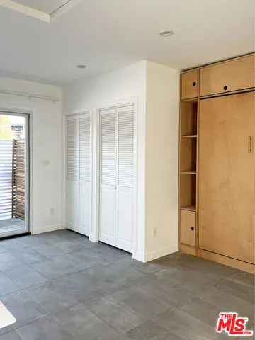 an empty room with an entrance door