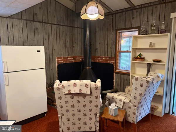 a kitchen with a refrigerator and a sink