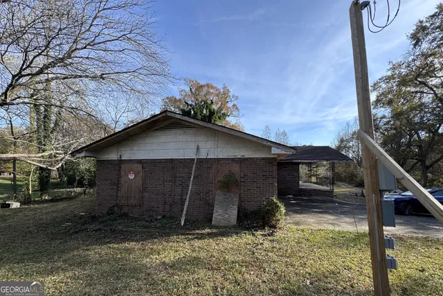 a house with trees in the background