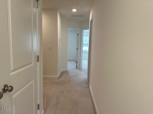739 Rdg Clf Lane Zebulon, NC 27597 - Photo 13 of 22 a view of a hallway with closet area