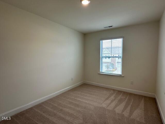 739 Rdg Clf Lane Zebulon, NC 27597 - Photo 15 of 22 an empty room with a window