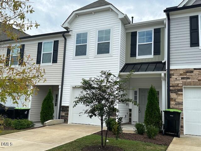 739 Rdg Clf Lane Zebulon, NC 27597 - Photo 3 of 22 a front view of a house with garden