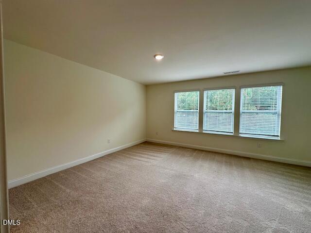 739 Rdg Clf Lane Zebulon, NC 27597 - Photo 9 of 22 an empty room with a window