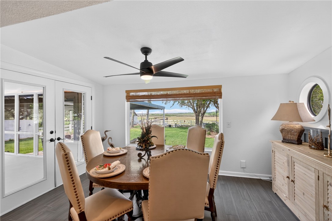 24937 County Road 350 Mathis, TX 78368 - Photo 12 of 39 a view of a dining room with furniture window and wooden floor