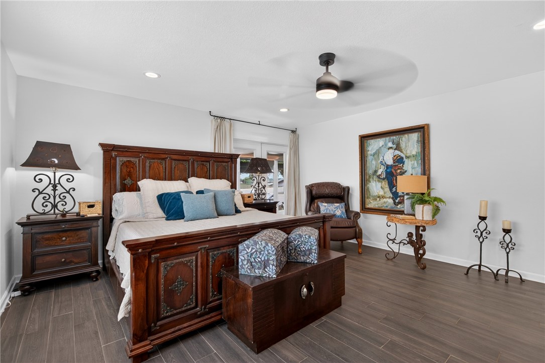 24937 County Road 350 Mathis, TX 78368 - Photo 18 of 39 a bed room with bed and furniture