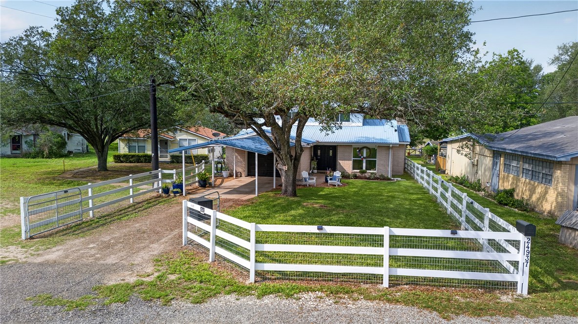 24937 County Road 350 Mathis, TX 78368 - Photo 2 of 39 a front view of a house with a yard