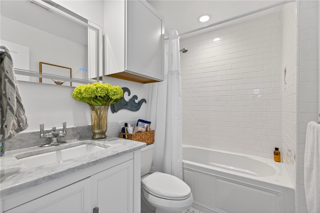24937 County Road 350 Mathis, TX 78368 - Photo 22 of 39 a bathroom with a sink a toilet and shower