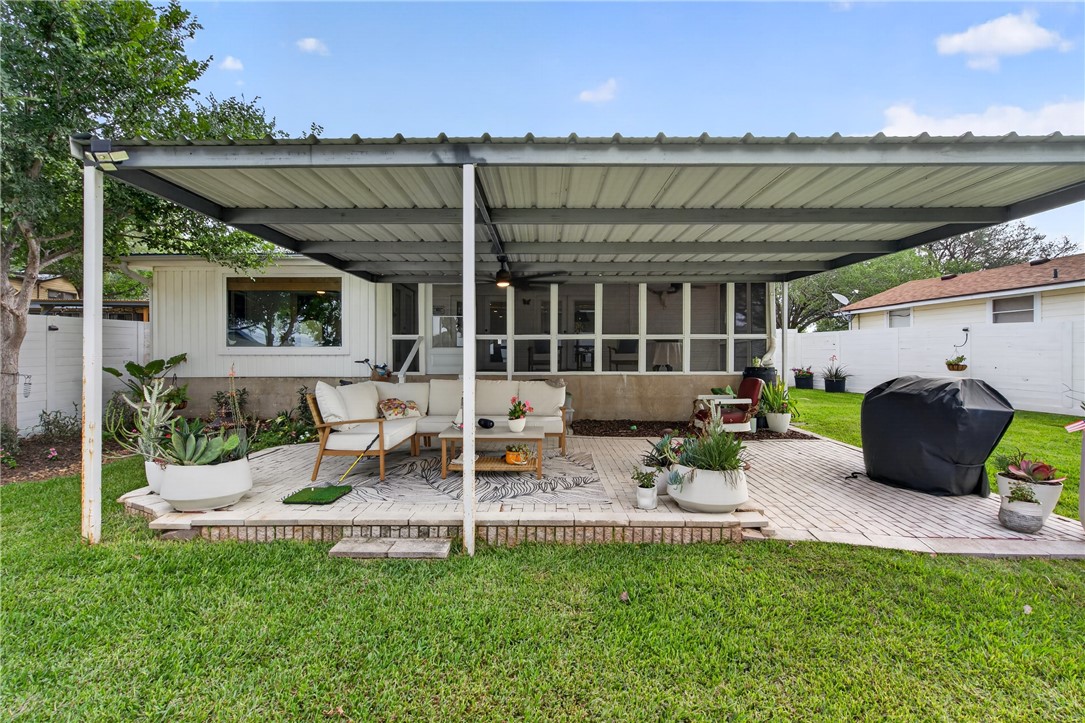 24937 County Road 350 Mathis, TX 78368 - Photo 27 of 39 a view of a patio with table and chairs with wooden floor and fence