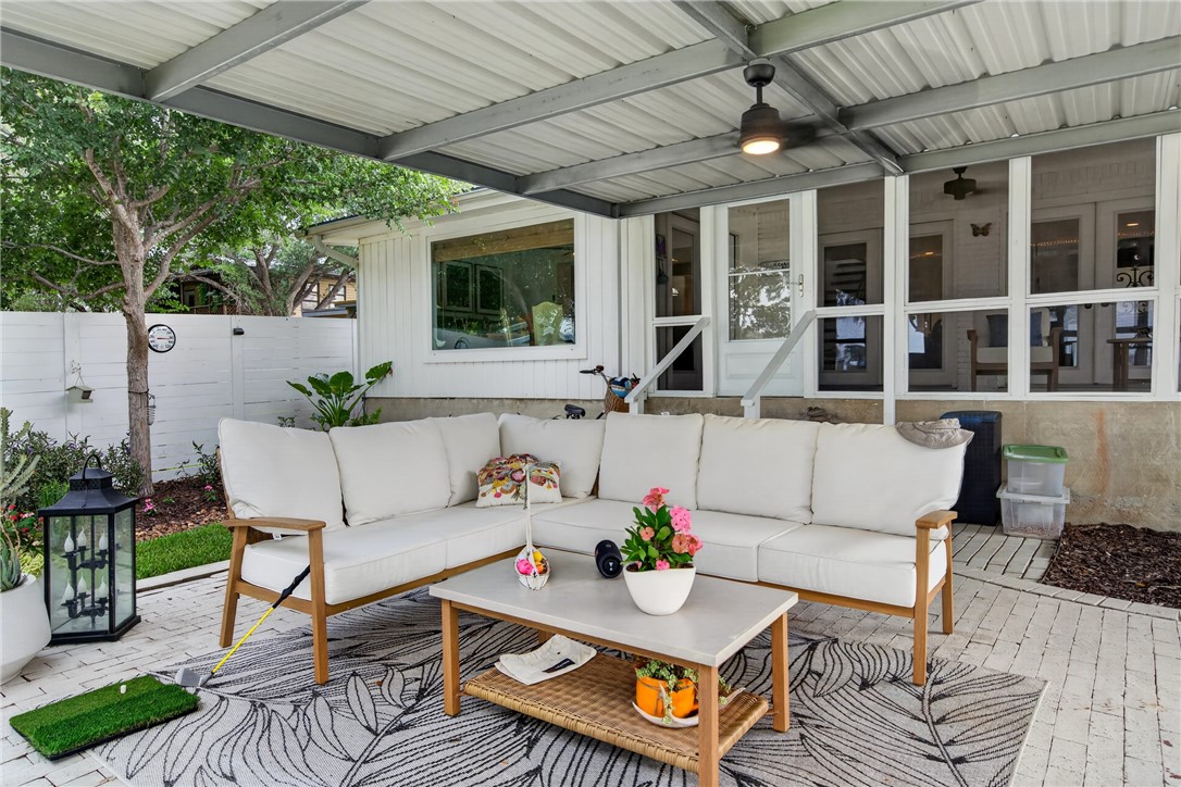 24937 County Road 350 Mathis, TX 78368 - Photo 29 of 39 a view of a patio with table and chairs with wooden floor and fence