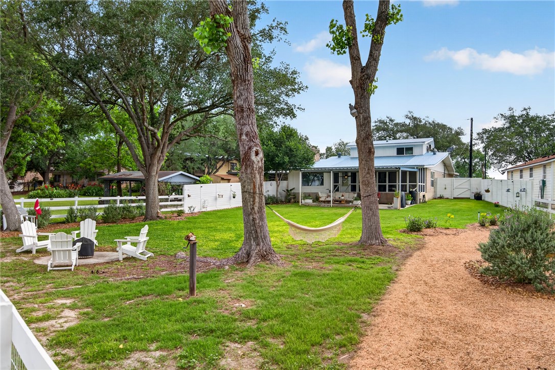 24937 County Road 350 Mathis, TX 78368 - Photo 30 of 39 a view of a house with a swimming pool and a yard