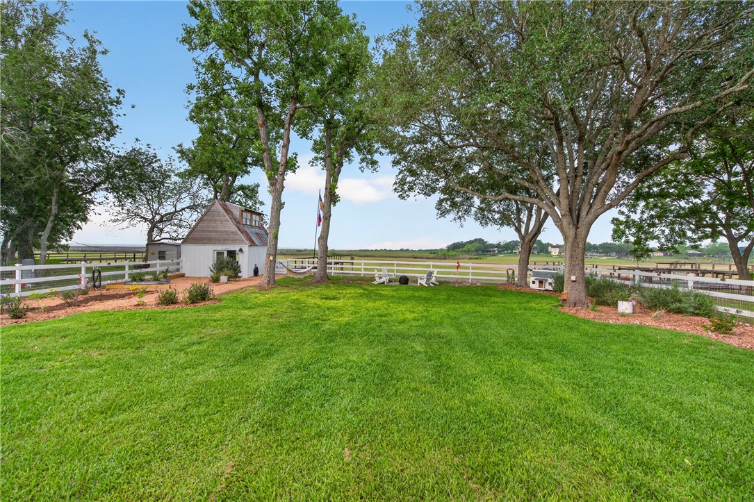 24937 County Road 350 Mathis, TX 78368 - Photo 32 of 39 a view of outdoor space with deck and trees