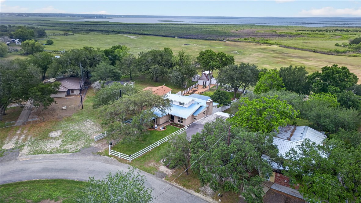 24937 County Road 350 Mathis, TX 78368 - Photo 38 of 39 a view of a lake with a house in a yard