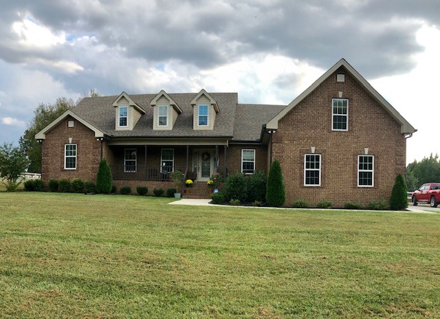 204 Goshen Road Lebanon, TN 37087 - Photo 1 of 24 a front view of a house with a yard and garage