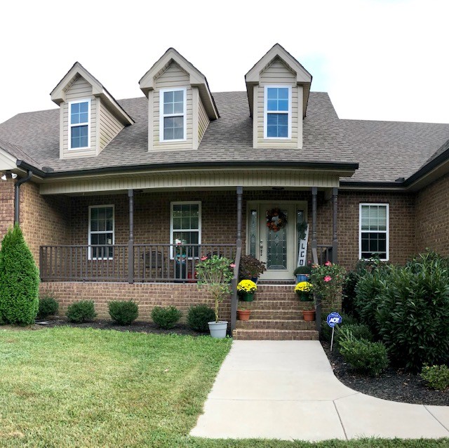 204 Goshen Road Lebanon, TN 37087 - Photo 2 of 24 a front view of a house with garden and porch