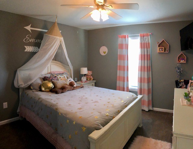 204 Goshen Road Lebanon, TN 37087 - Photo 13 of 24 a bedroom with a bed and a chandelier