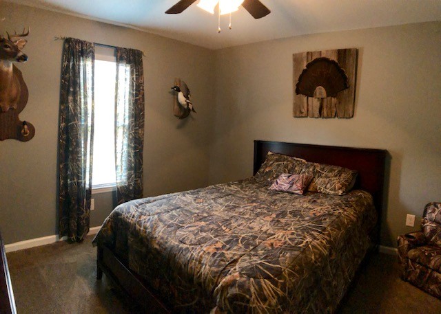 204 Goshen Road Lebanon, TN 37087 - Photo 15 of 24 a bedroom with a bed and a chandelier