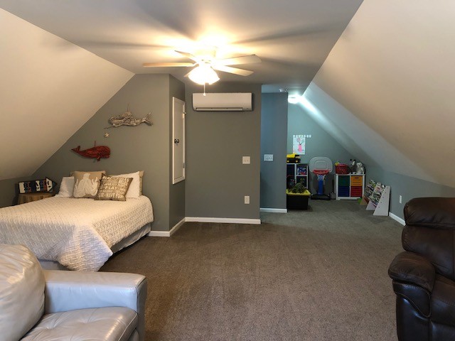 204 Goshen Road Lebanon, TN 37087 - Photo 19 of 24 a bedroom with furniture and a chandelier