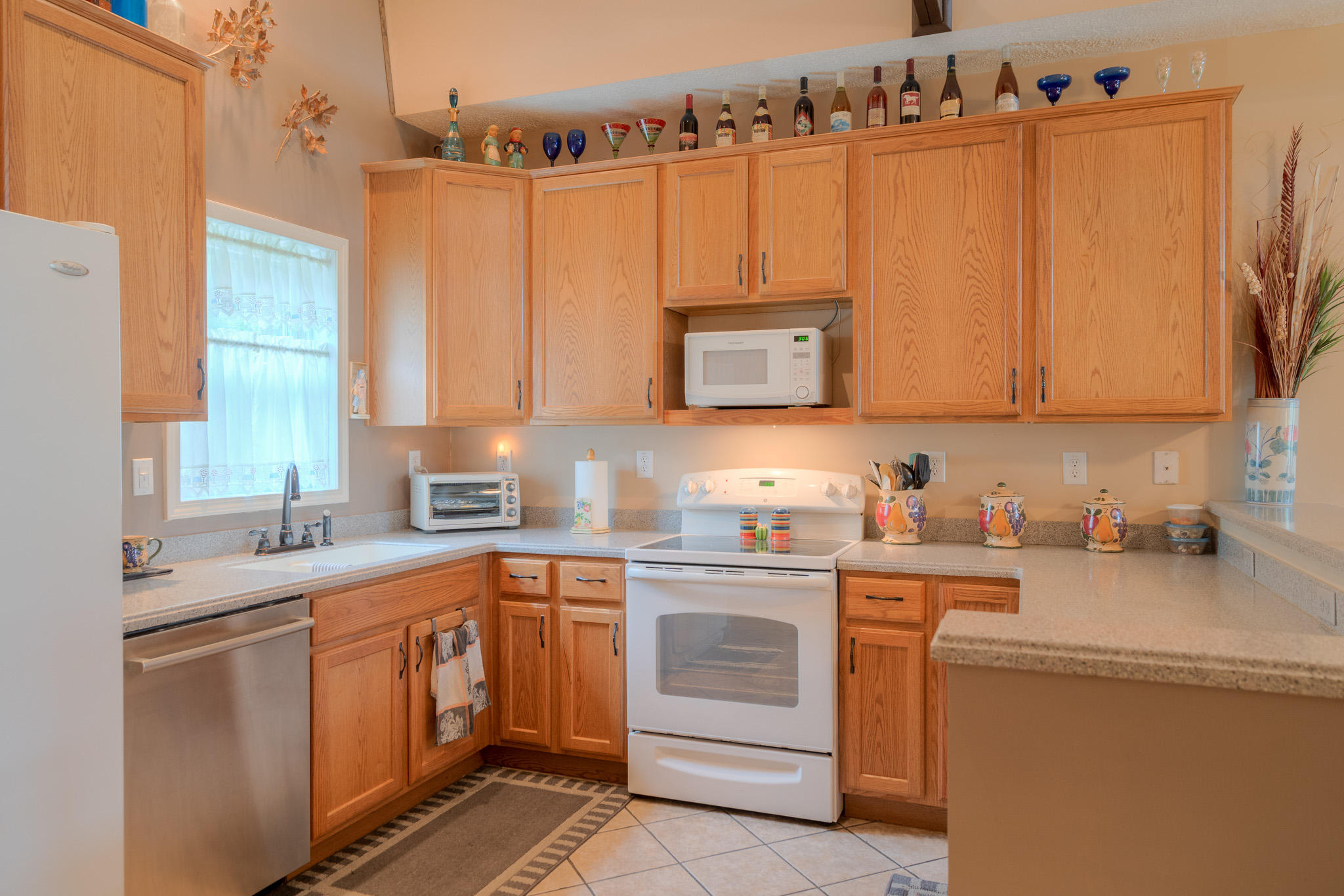 355 Sam Reed Road Northwest Floyd, VA 24091 - Photo 12 of 37 a kitchen with stainless steel appliances granite countertop a sink a stove and cabinets