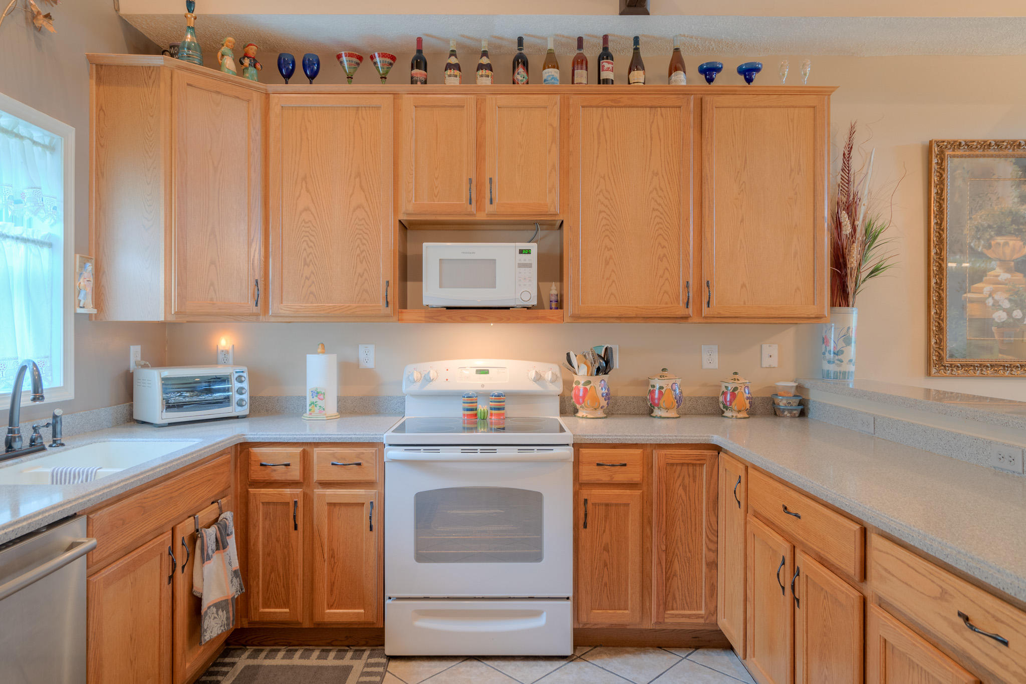 355 Sam Reed Road Northwest Floyd, VA 24091 - Photo 13 of 37 a kitchen with stainless steel appliances granite countertop a stove a sink and a white cabinets