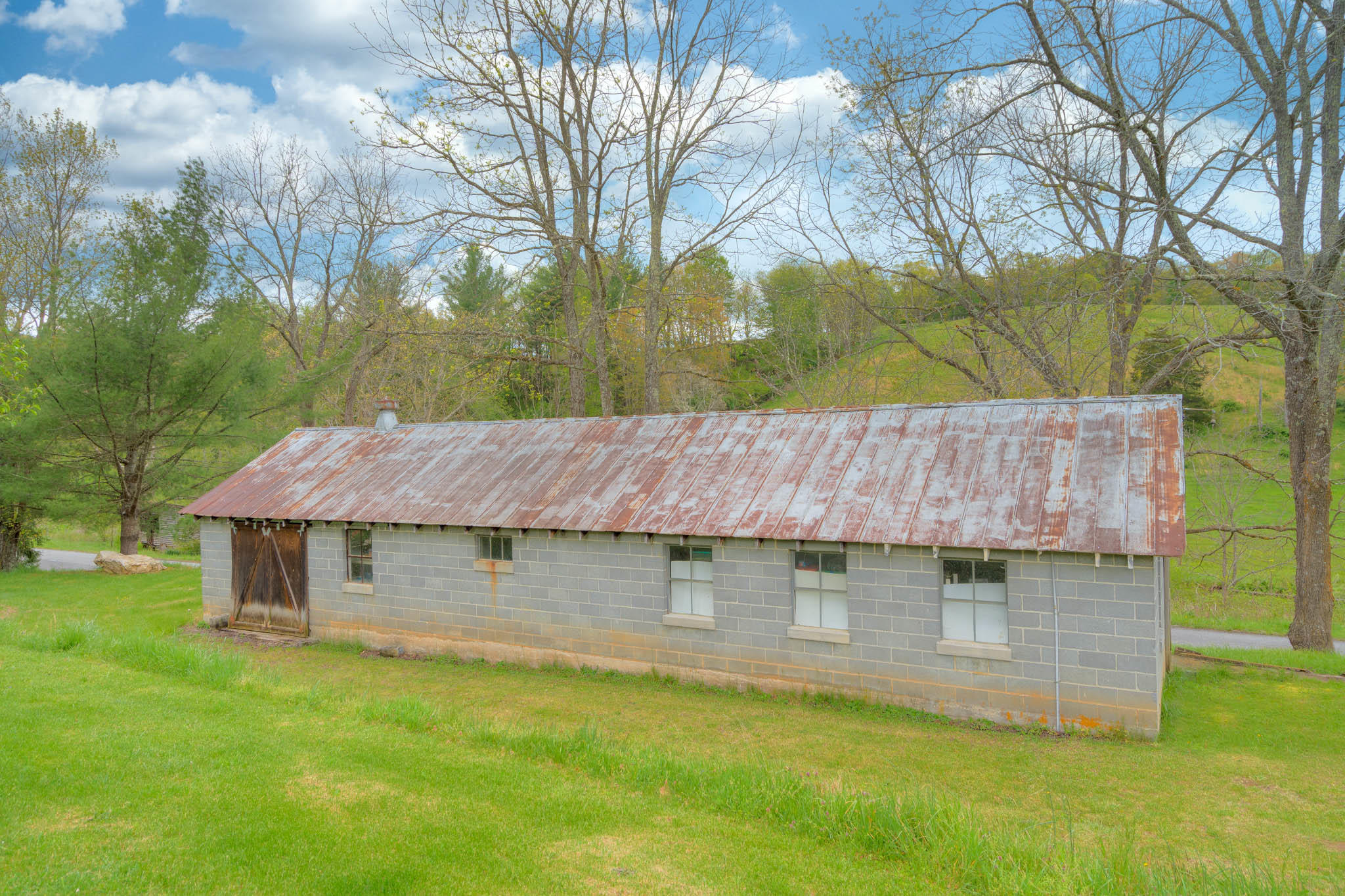 355 Sam Reed Road Northwest Floyd, VA 24091 - Photo 37 of 37 a backyard of a house with table and chairs