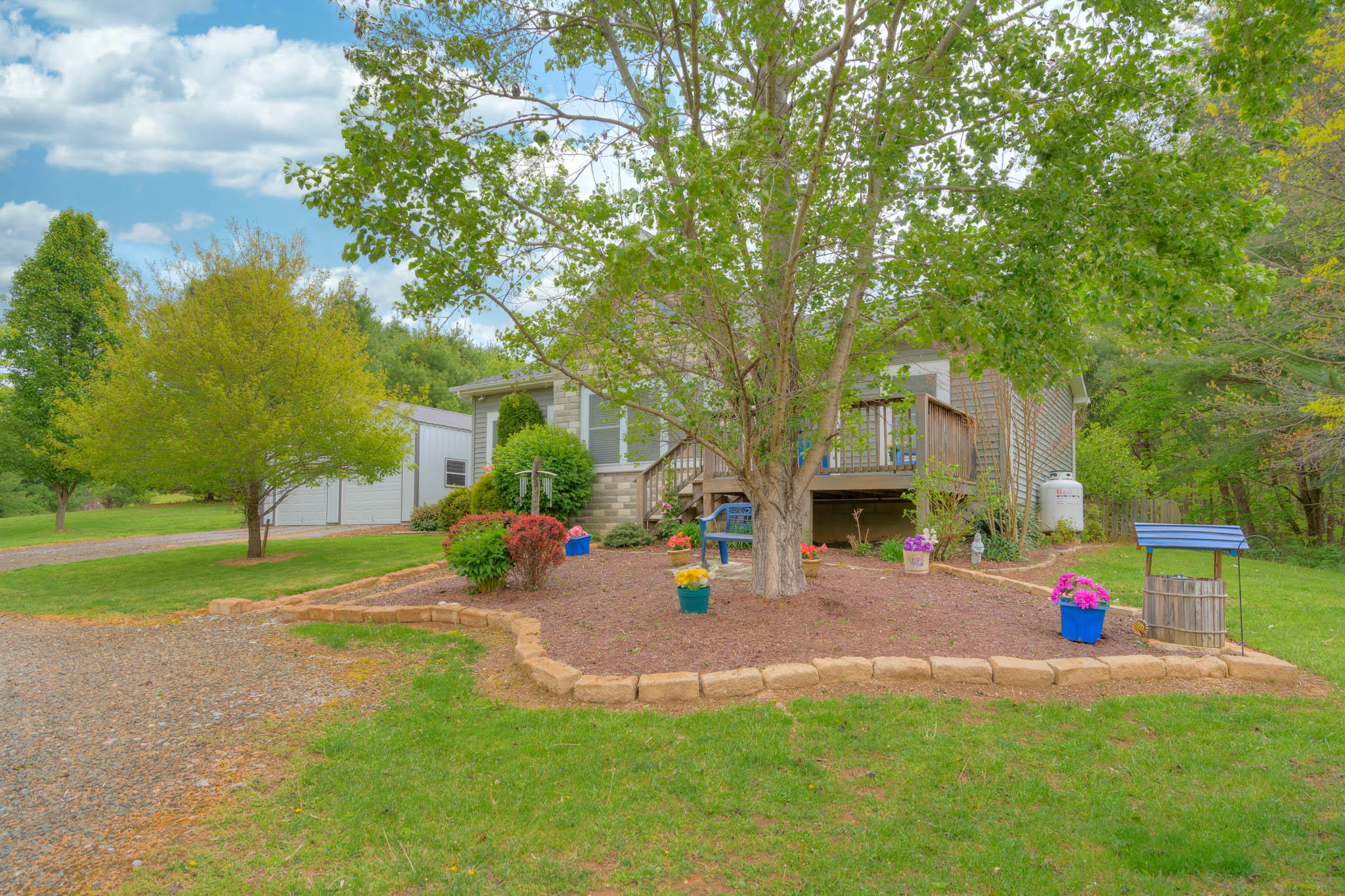355 Sam Reed Road Northwest Floyd, VA 24091 - Photo 5 of 37 a view of a house with a backyard and a tree