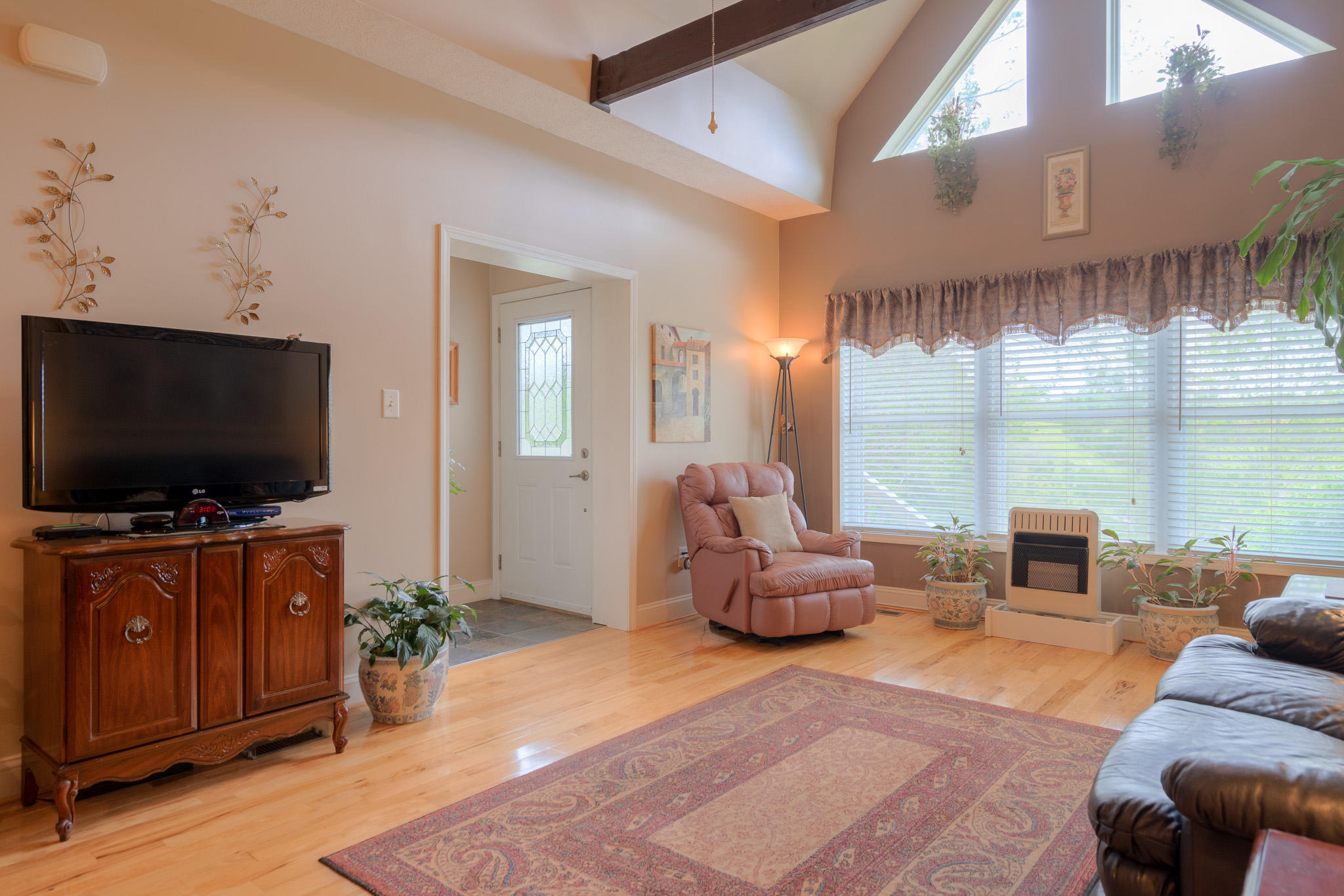 355 Sam Reed Road Northwest Floyd, VA 24091 - Photo 8 of 37 a living room with furniture and a flat screen tv