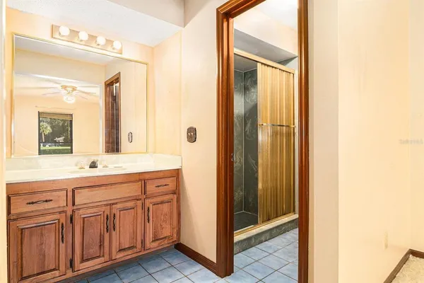a bathroom with a double vanity sink and mirror