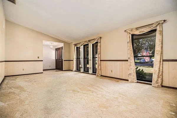 a view of an empty room with a window