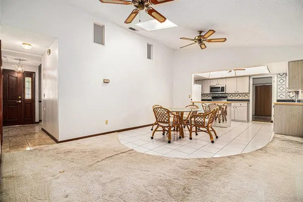 a view of a dining room and kitchen