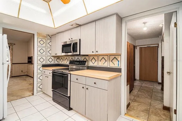 a kitchen with a stove and a sink