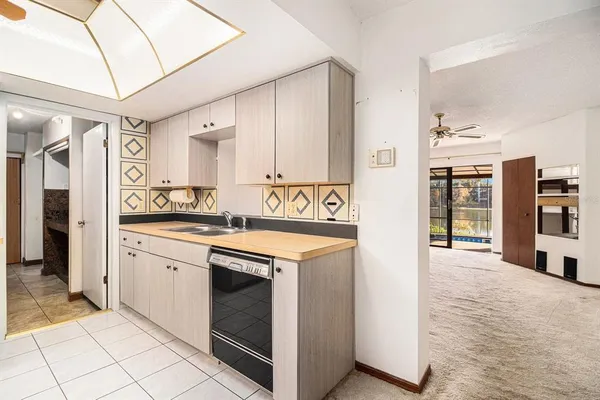a kitchen with a stove a sink and a refrigerator