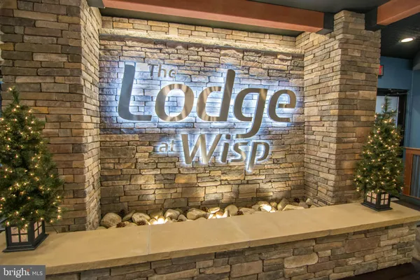 a street sign on a brick wall