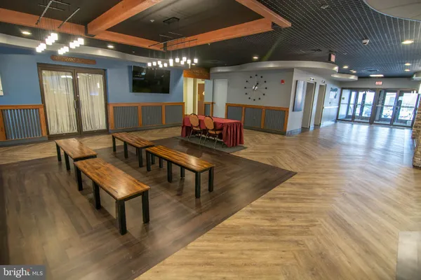 a lobby with furniture and wooden floor