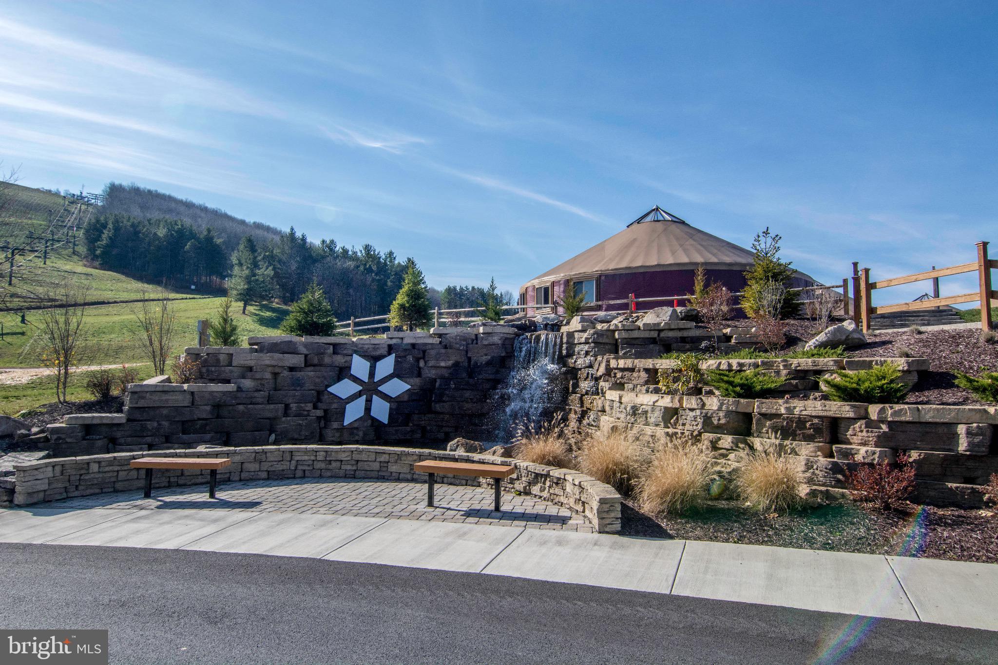 290 Marsh Hill Road, Unit 319C McHenry, MD 21541 - Photo 20 of 33 a view of a patio with plants and chairs