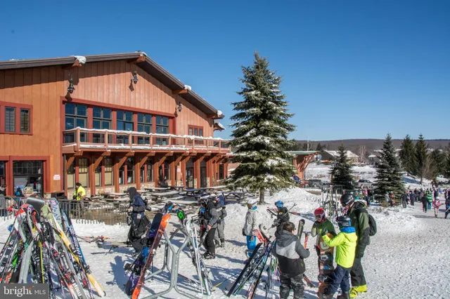 a view of building with car parked