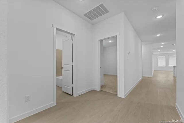 an empty room with a bathroom