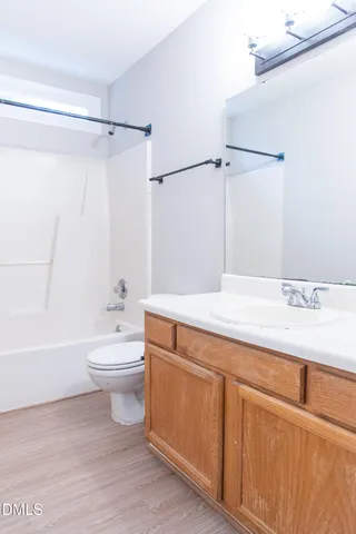 a bathroom with a sink a toilet and a bathtub