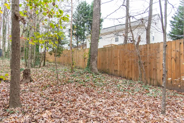 a view of a wooden house with large windows