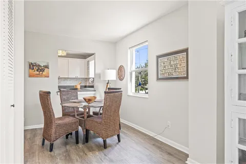 a view of a dining room with furniture and a window
