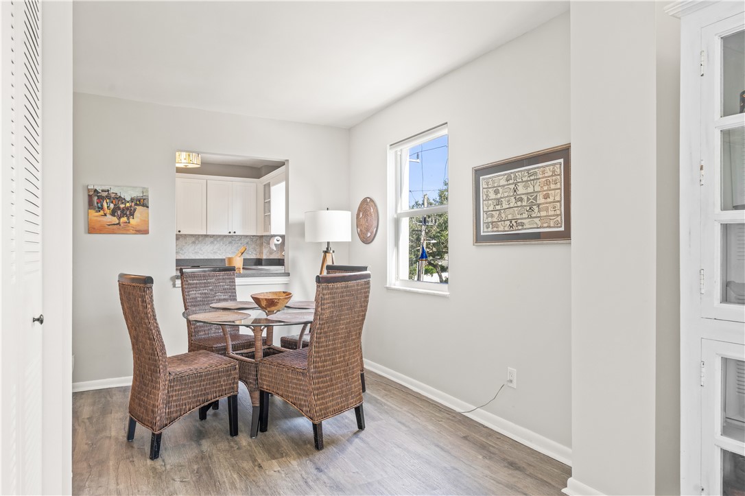 275 Date Palm Road, Unit 307 Vero Beach, FL 32963 - Photo 11 of 36 a view of a dining room with furniture and a window