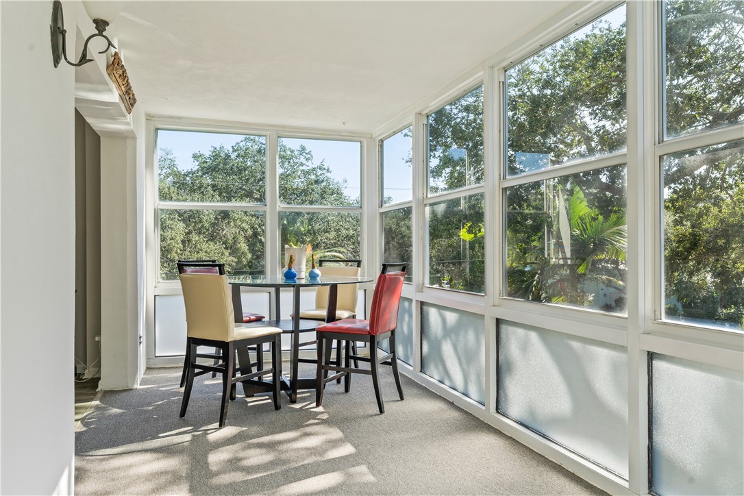 275 Date Palm Road, Unit 307 Vero Beach, FL 32963 - Photo 15 of 36 a view of a dining room with furniture window and outside view