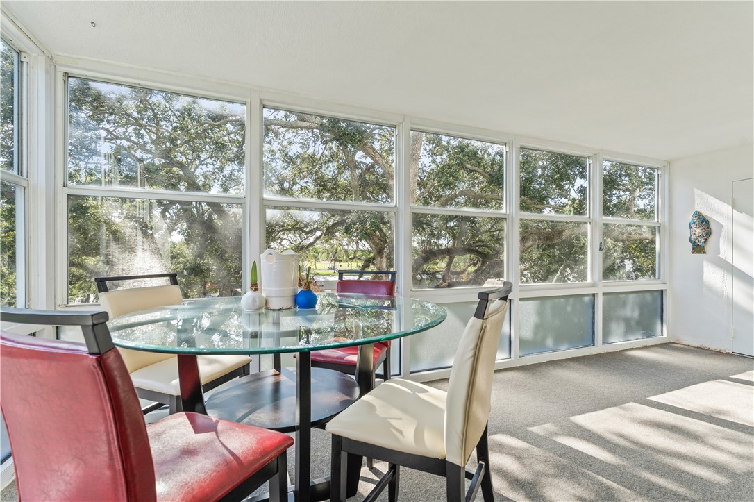 275 Date Palm Road, Unit 307 Vero Beach, FL 32963 - Photo 16 of 36 a dining room with furniture window and outside view