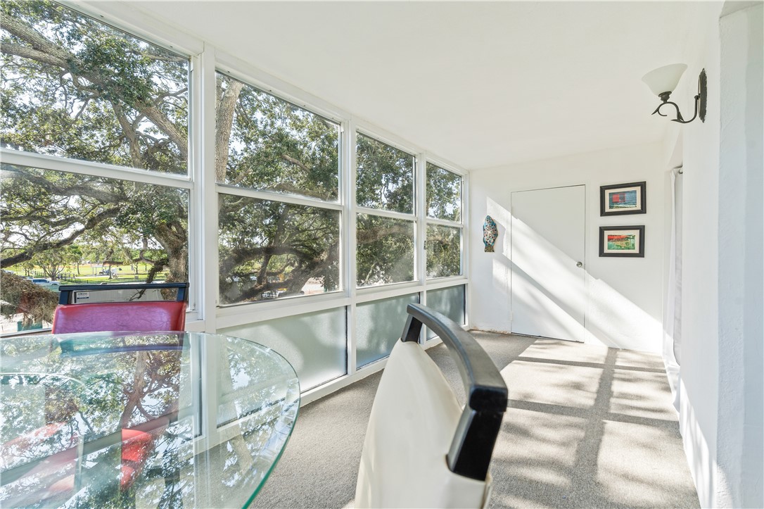 275 Date Palm Road, Unit 307 Vero Beach, FL 32963 - Photo 17 of 36 a view of a room with wooden floor and windows