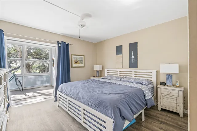 a bedroom with a large bed and a large window