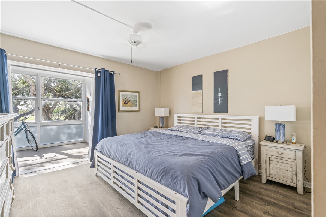 275 Date Palm Road, Unit 307 Vero Beach, FL 32963 - Photo 18 of 36 a bedroom with a large bed and a large window