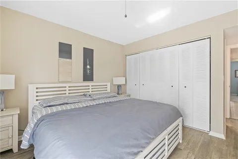 a bedroom with a bed and a cabinets