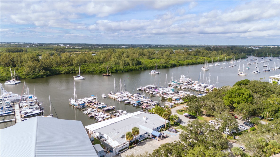 275 Date Palm Road, Unit 307 Vero Beach, FL 32963 - Photo 27 of 36 an aerial view of a house with a lake view