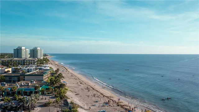 a view of an ocean beach and city