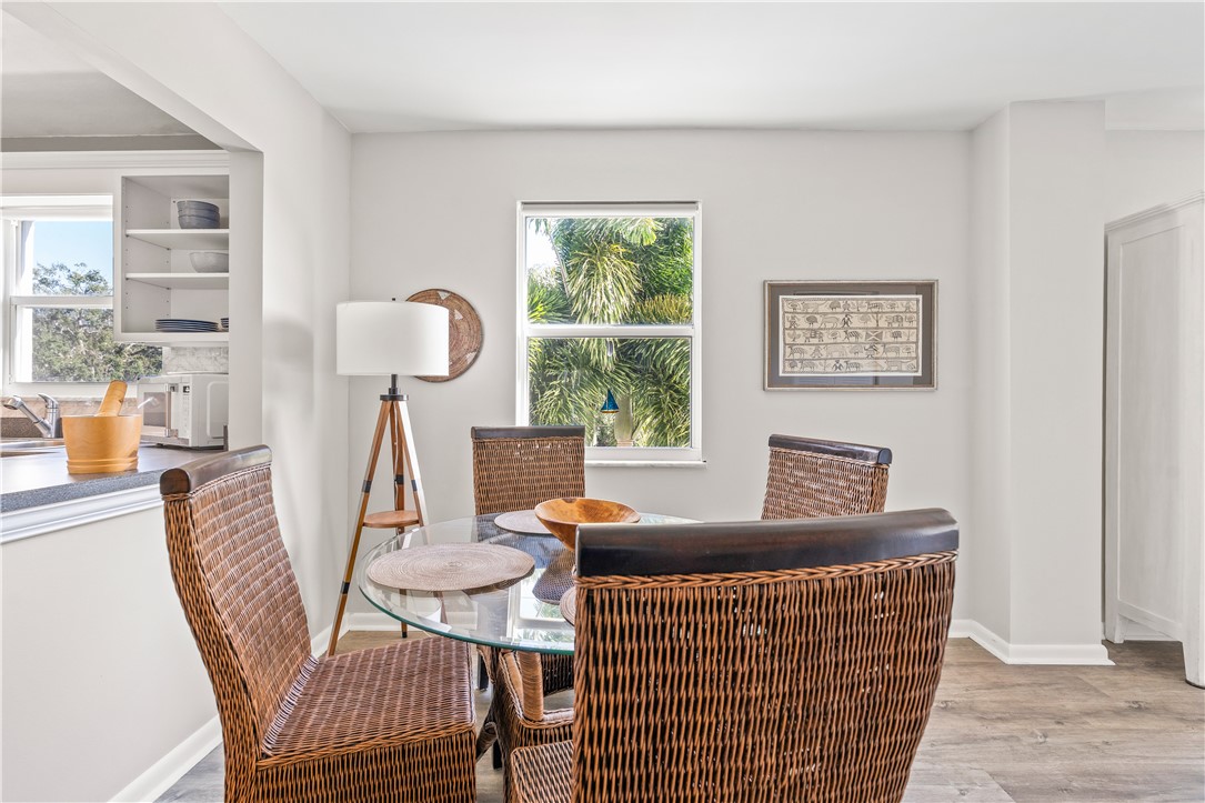 275 Date Palm Road, Unit 307 Vero Beach, FL 32963 - Photo 10 of 36 a living room with furniture a window and a table